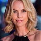 CharlizeTheronGunmanWorldPremiereRedCarpet_05.jpg
