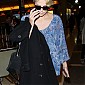 CharlizeTheronArrivesLAXairport_07.jpg