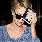 CharlizeTheronArrivesLAXairport_10.jpg