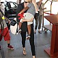 CharlizeandhersonJacksondepartingonflightatLAX_01.jpg