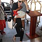 CharlizeandhersonJacksondepartingonflightatLAX_02.jpg