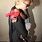 CharlizeandhersonJacksondepartingonflightatLAX_07.jpg