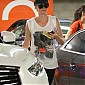 CharlizeTheronStopsbygymworkoutWH_07.jpg