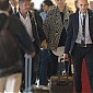 CharlizeTheronEmbarquementLAAeroportParis_06.jpg